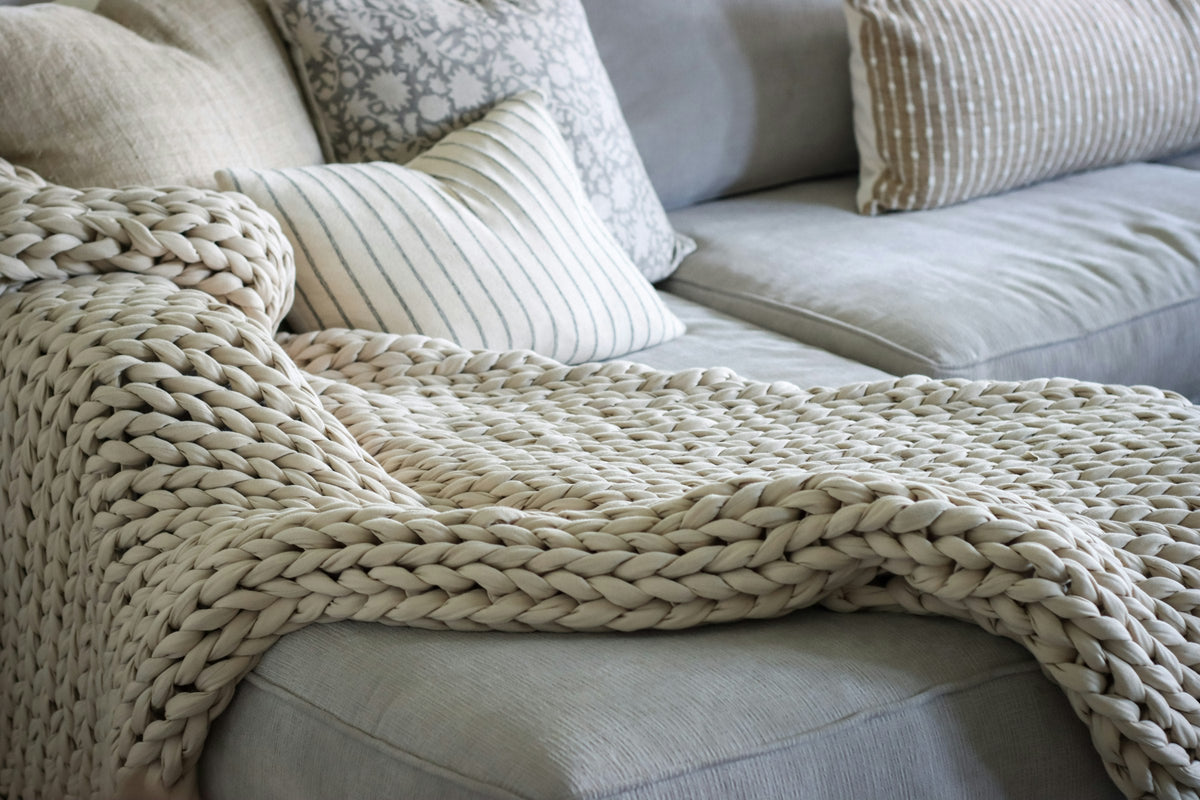 Chunky knit blanket on a sofa