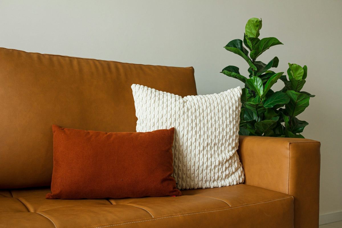 Terracotta and cream cushions on a sofa
