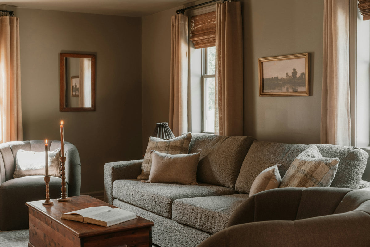 Warm neutral living room with sofa and cushions