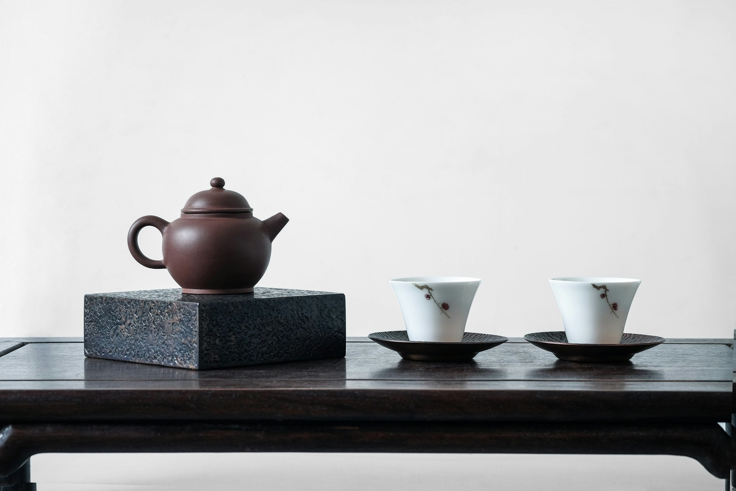 Minimal tea setting with teapot and two cups